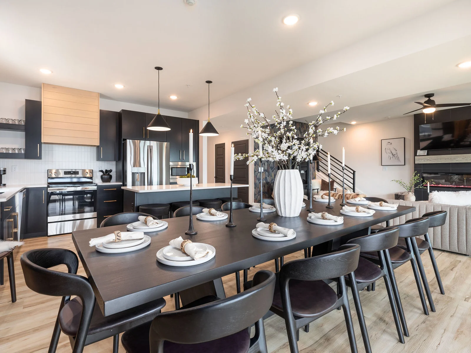 Seating for 12 at the dining table along with extra seating at the island and bar along the wall