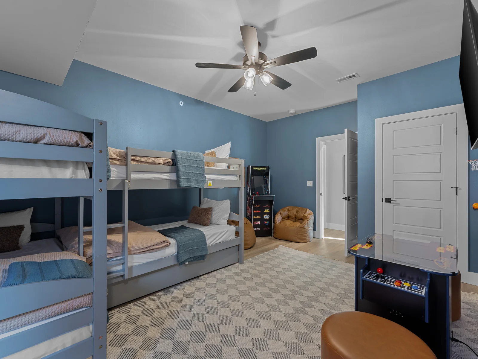 Bunk Room: Fun-filled space with arcade games and comfy bean bags for endless entertainment!