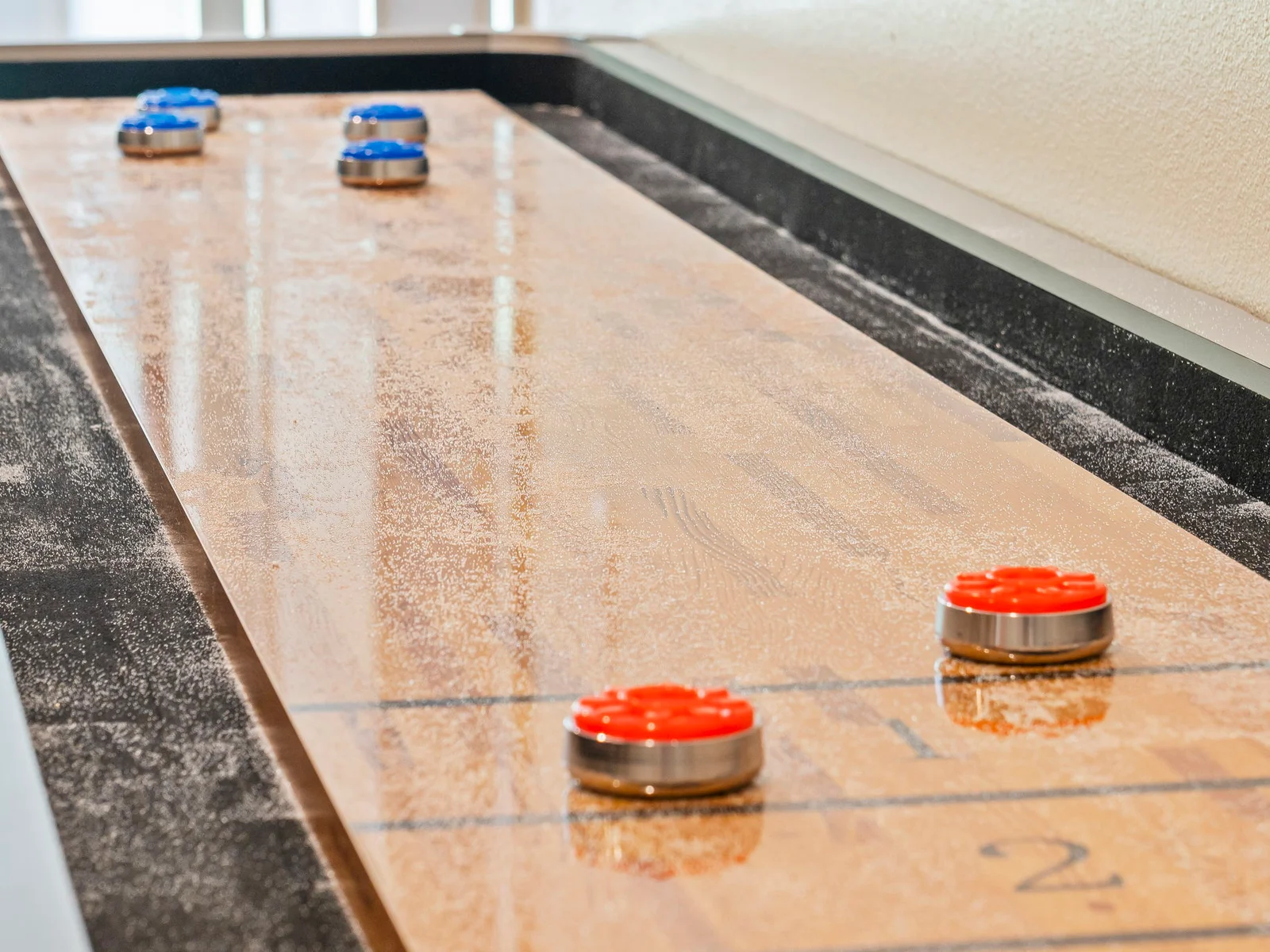 Compete in shuffleboard!