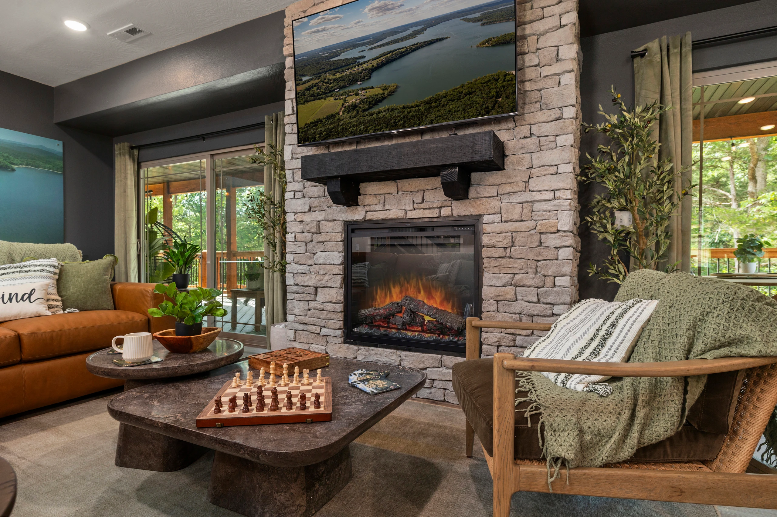 Cozy up to the stacked-stone fireplace with a chess match on the barrel table.