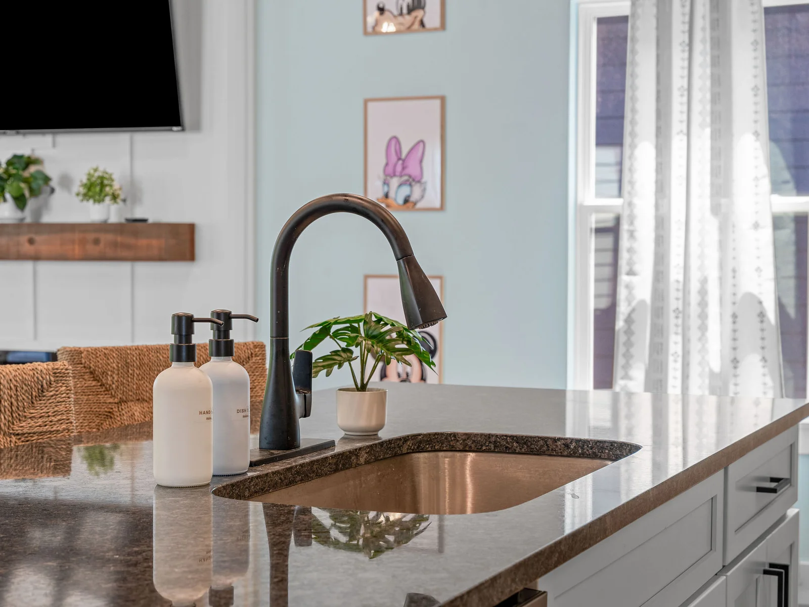 Modern finishes and a sleek faucet make this kitchen as functional as it is beautiful.