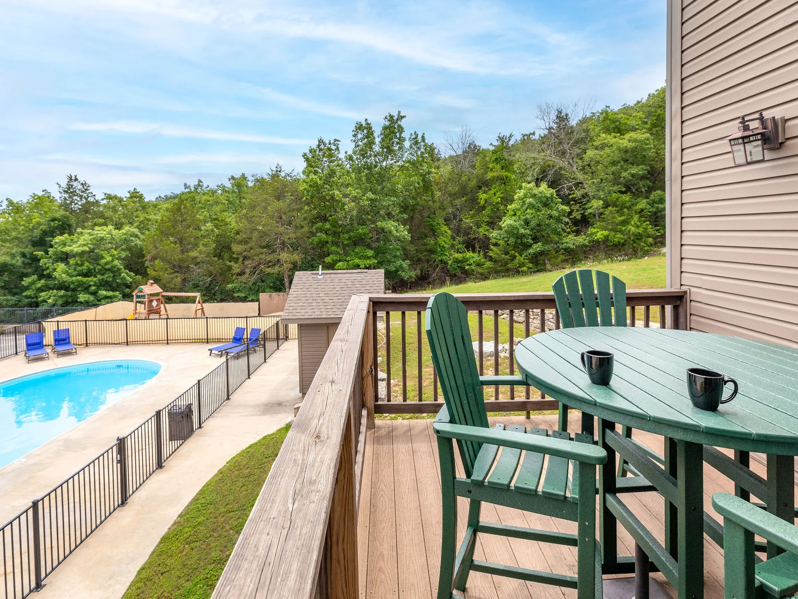 Relax on the back deck while watching your family in the pool!