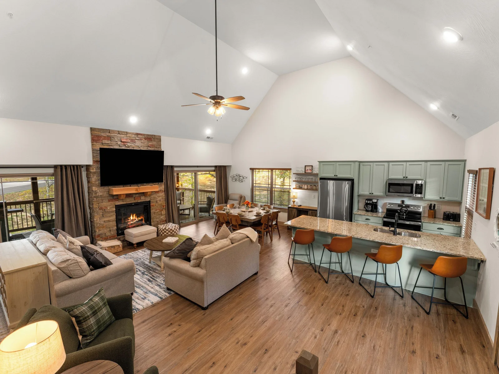 Very comfortable open concept living dining room with vaulted ceilings.