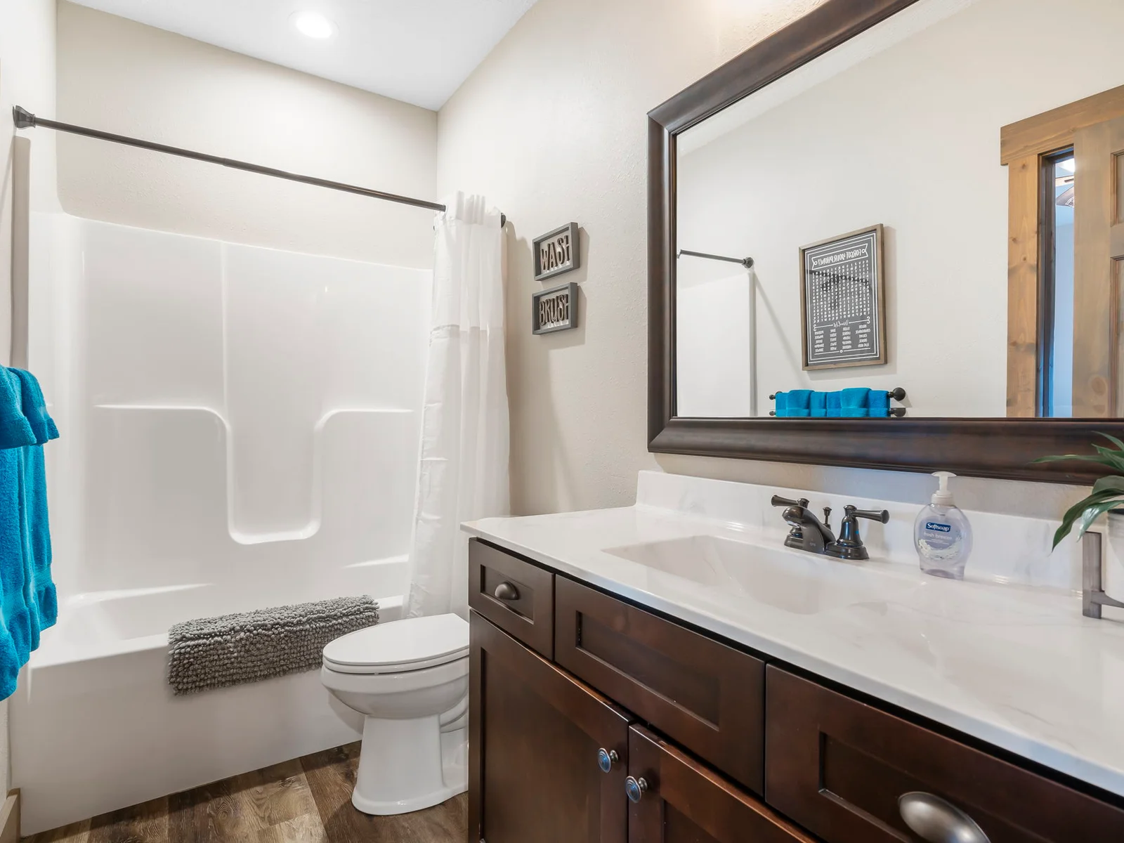 Bathroom for lower level queen beds, open to game room as well.