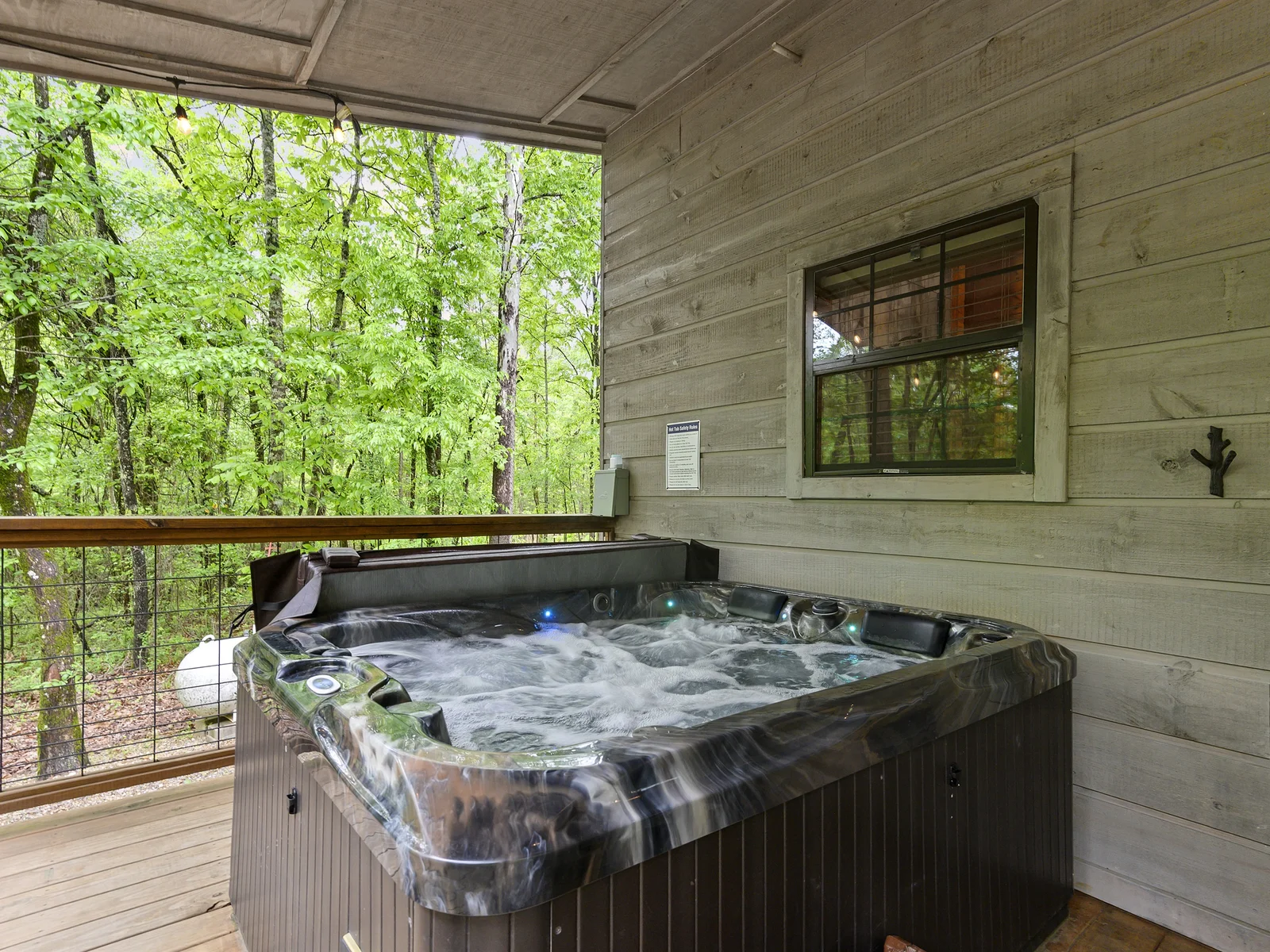 Nestled in the woods, where hot tub warmth and nature’s calm create pure serenity beneath the stars. 🌲✨
