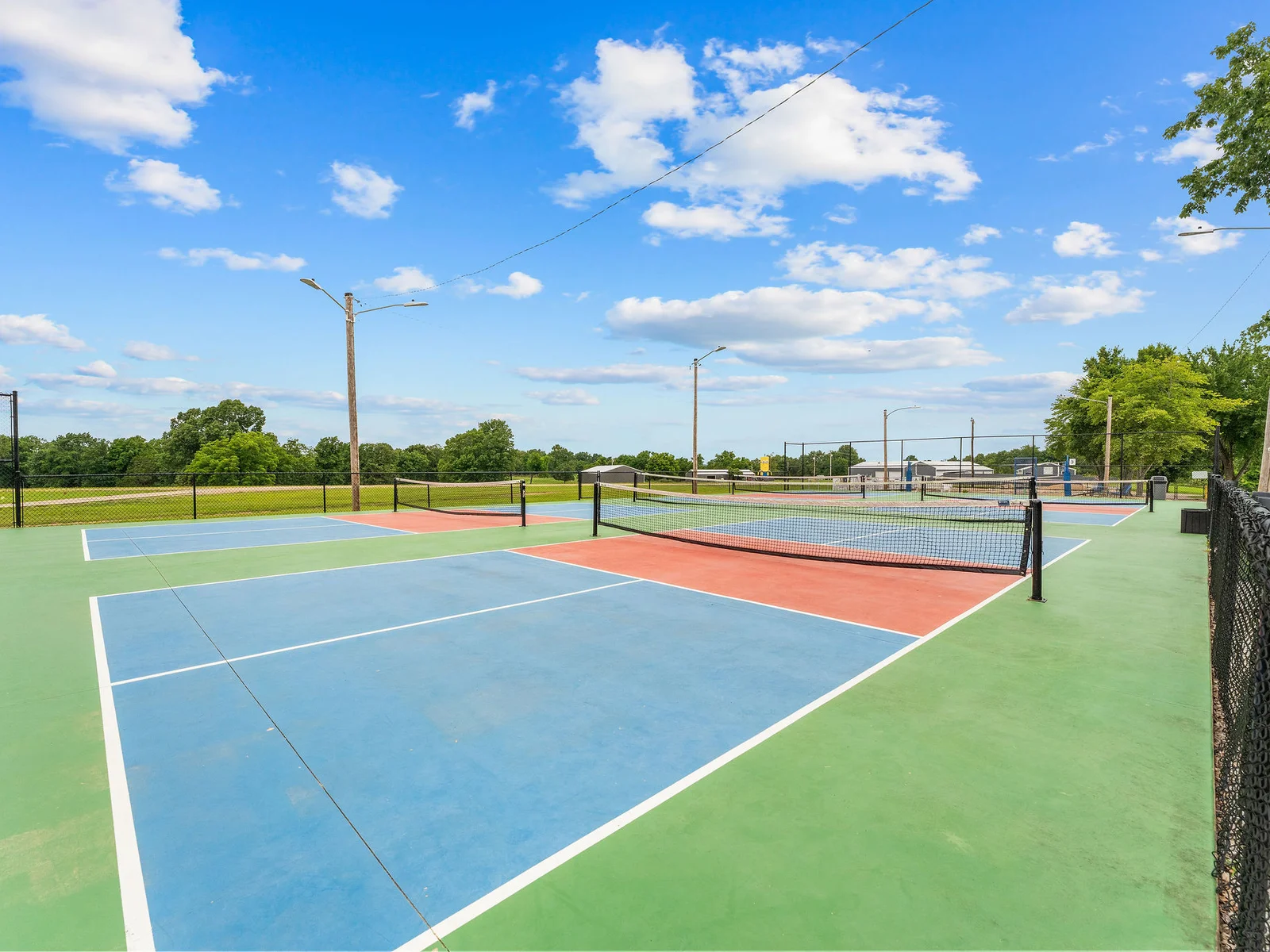 Four freshly lined pickleball courts inside Lost Woods Hideaway — grab rackets from the house and get a game going before dinner.