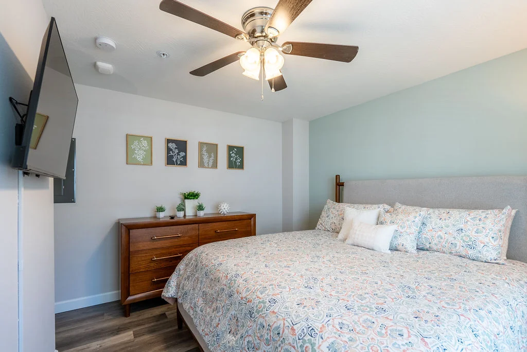 King bedroom 2 boasts luxury bedding, a dresser, 40" smart TV and phone chargers
