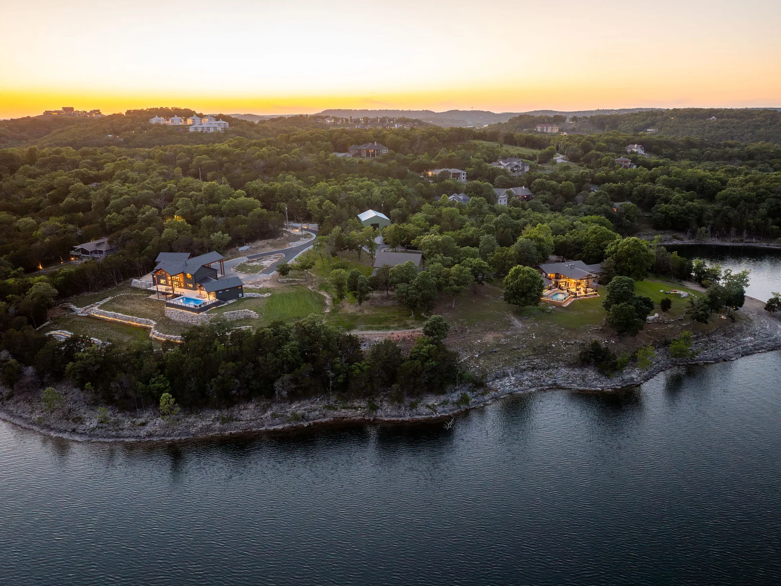 Elevated views showcase the full experience, pool, lake, outdoor spaces, and room to gather.