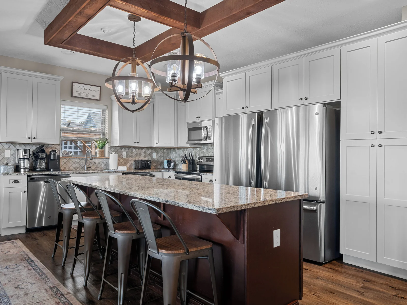 Main level kitchen. Two full-size refrigerators, two dishwashers, oven/ceramic glass cooktop, microwave, drip coffee maker, Keurig, and Nespresso. Stocked with small appliances, cookware, bakeware, utensils, dishes, glassware, mugs, and more!