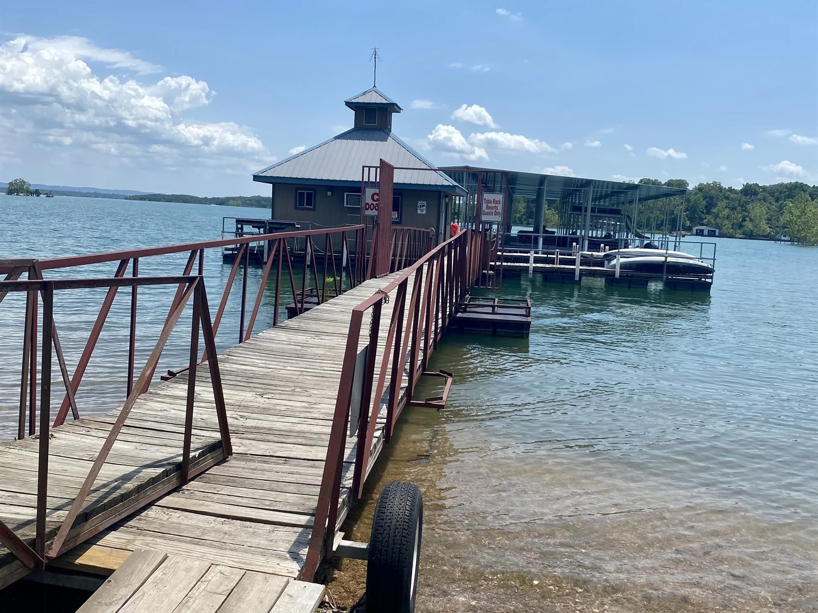 Kayaks and paddle boats available for checkout at the dock