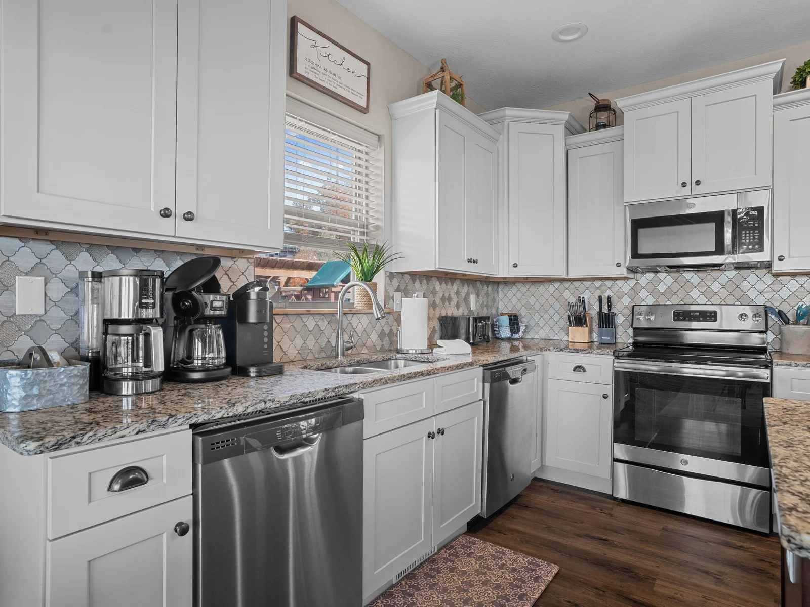 Main level kitchen. Two full-size refrigerators, two dishwashers, oven/ceramic glass cooktop, microwave, drip coffee maker, Keurig, and Nespresso. Stocked with small appliances, cookware, bakeware, utensils, dishes, glassware, mugs, and more!