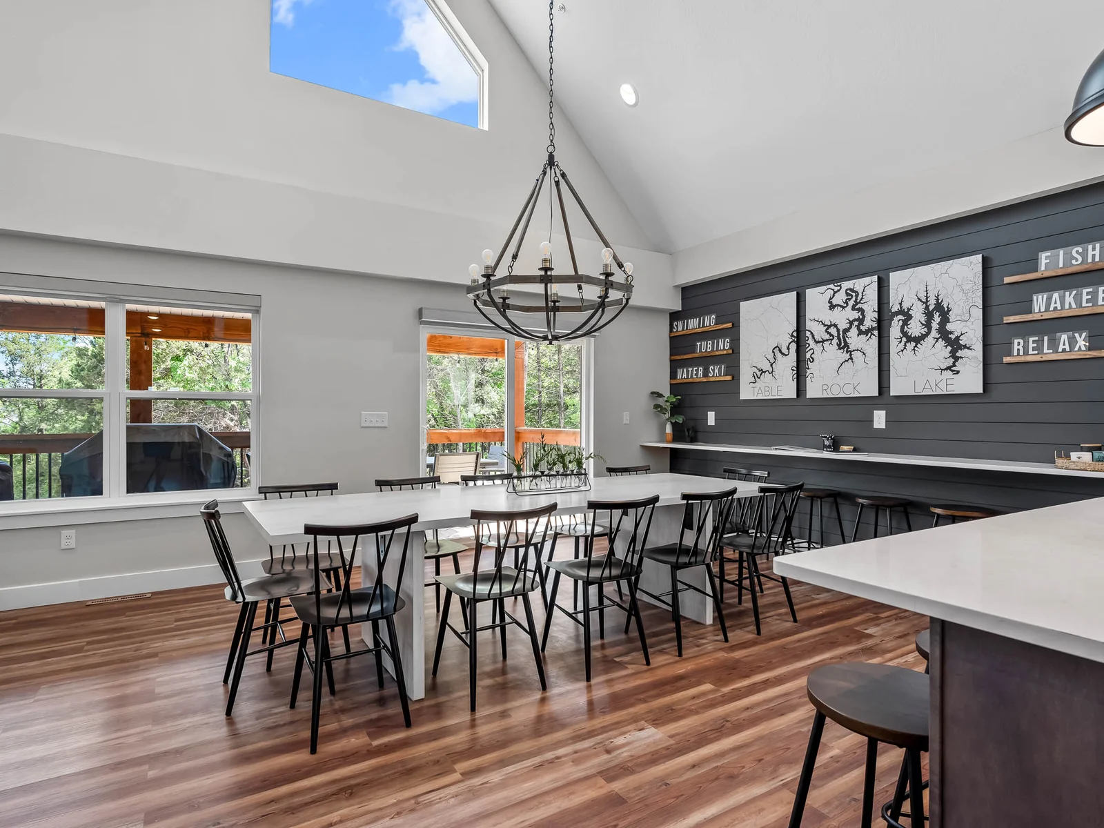 Walk out onto the upper deck with more seating and a propane grill