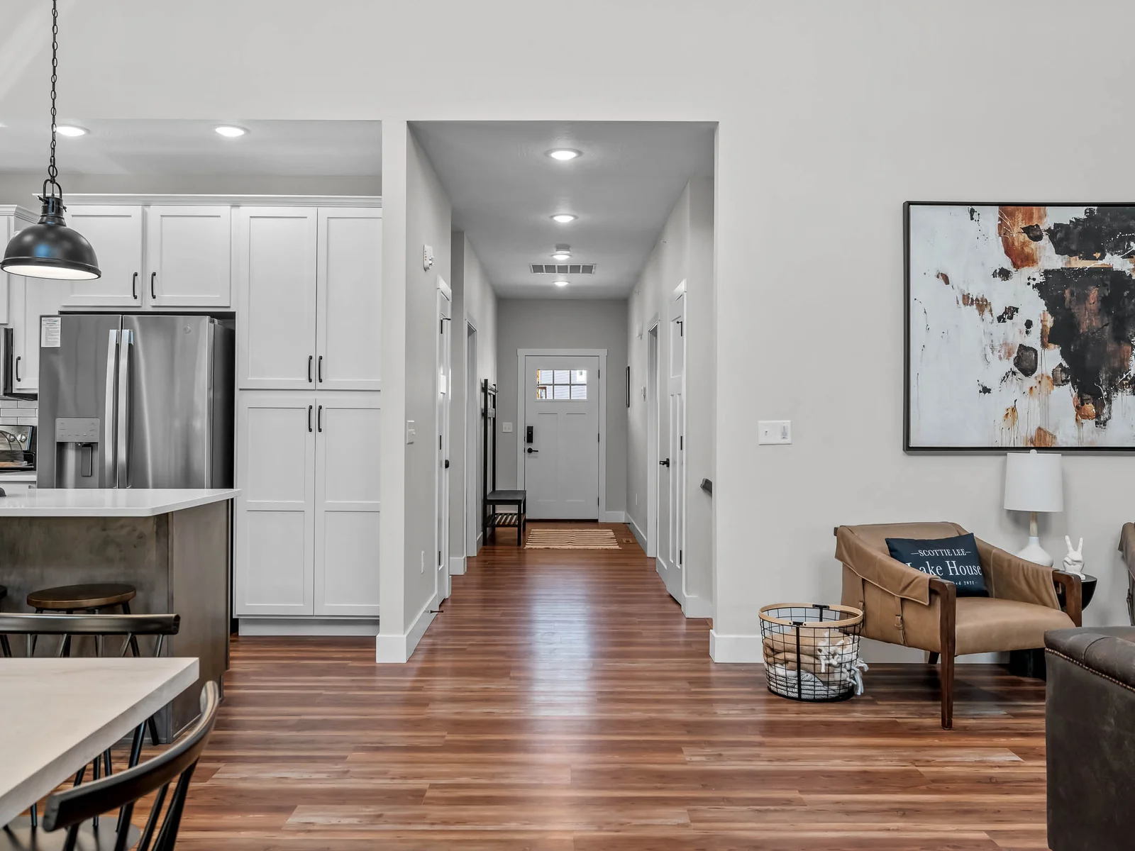 Entry hall leading into living and kitchen