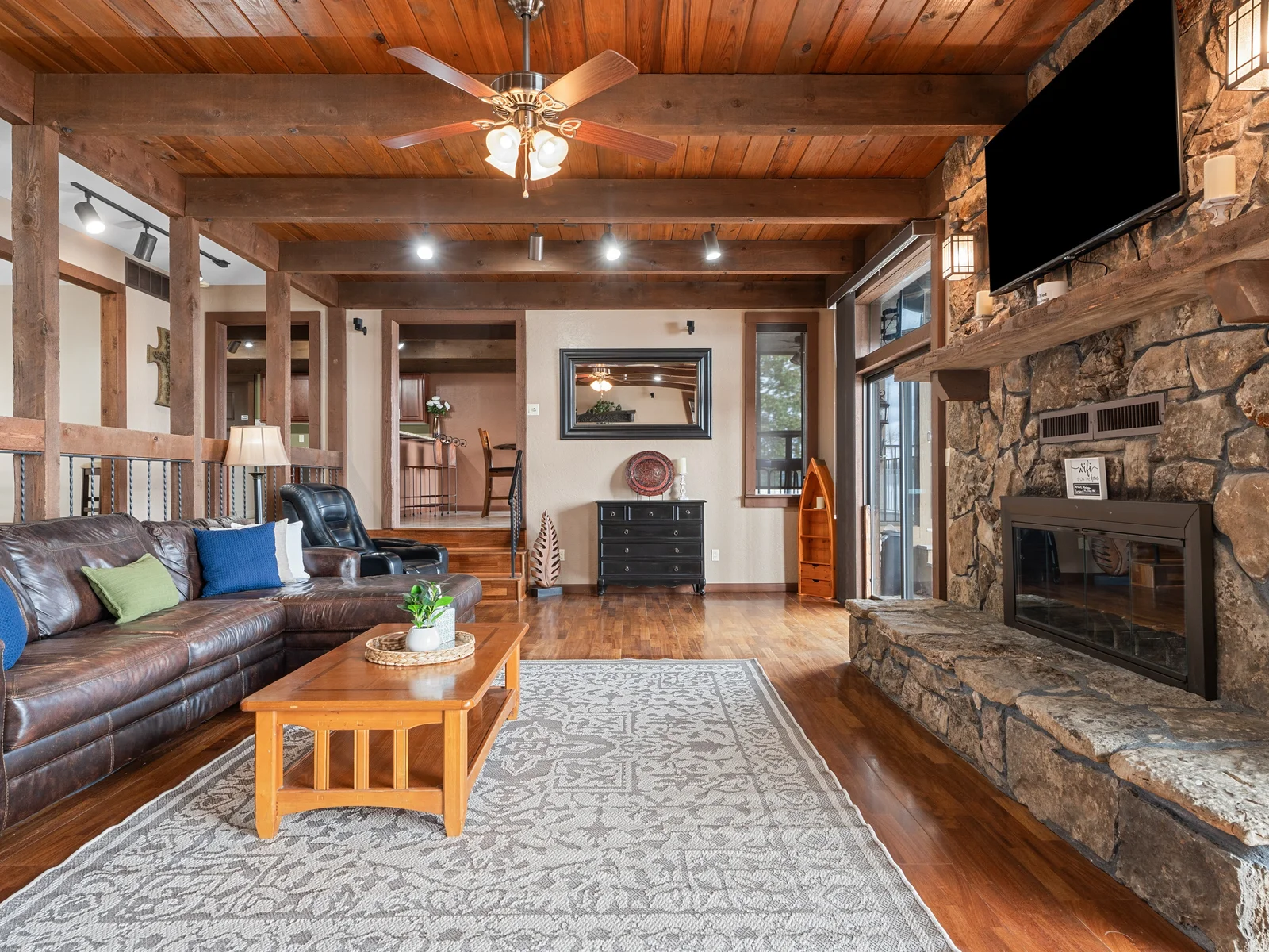 Gather in the warm, cozy living room with soaring ceilings, rustic details, and space to make memories together.