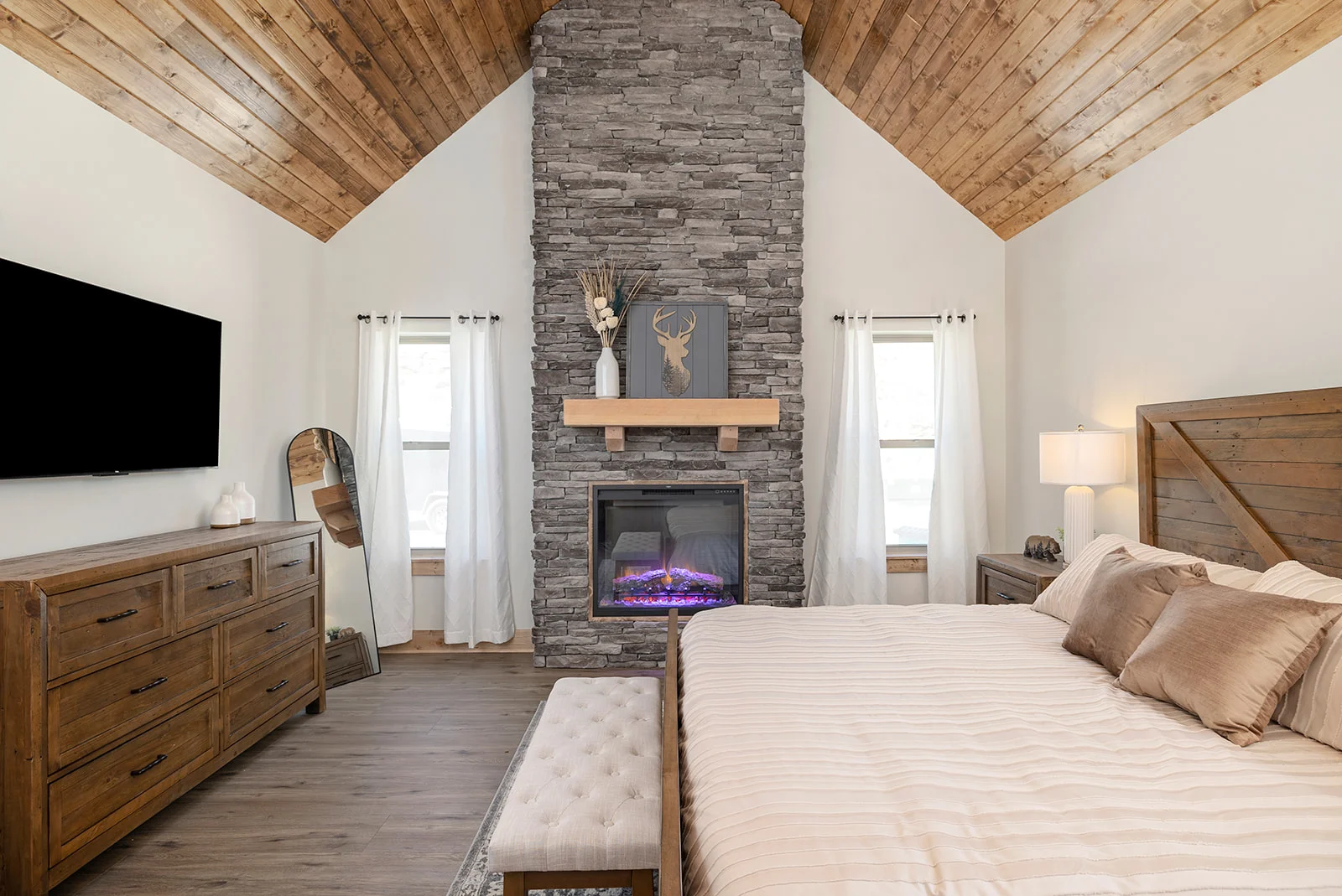 Main level master suite! Kind bed with a fireplace and ensuite bath!