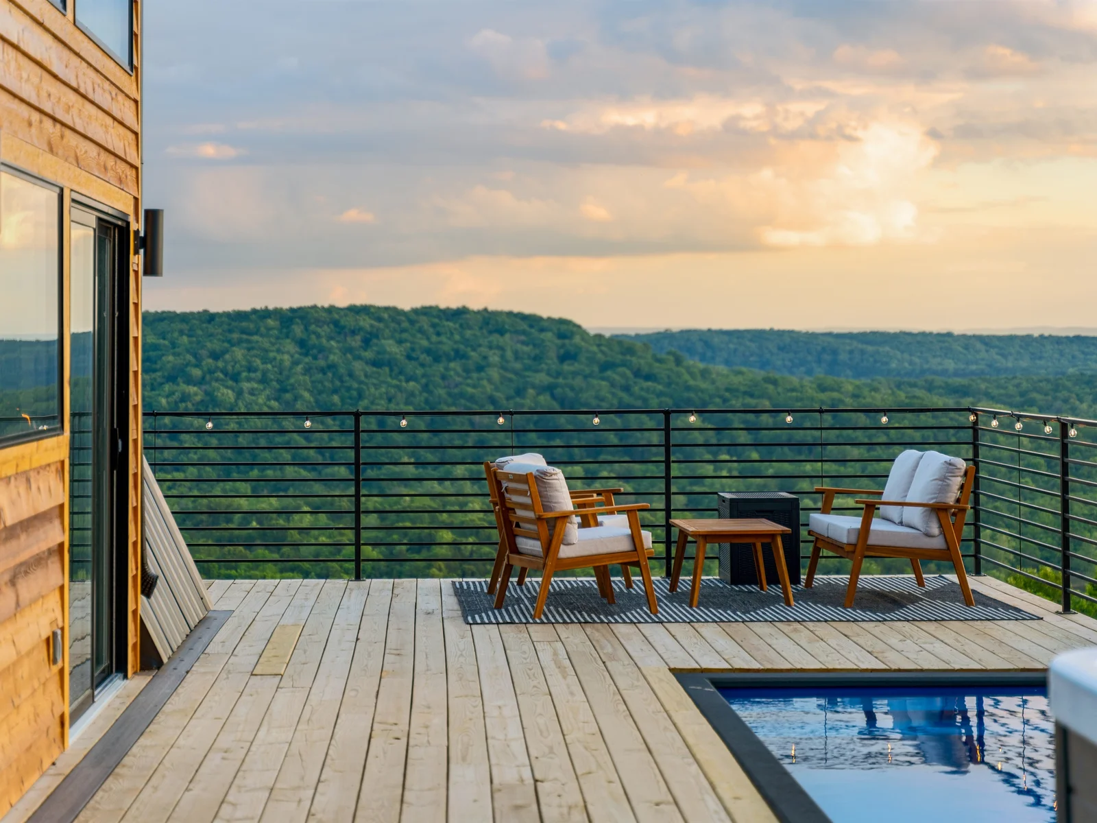 A perfect blend of comfort and scenery with Adirondack seating and poolside relaxation.