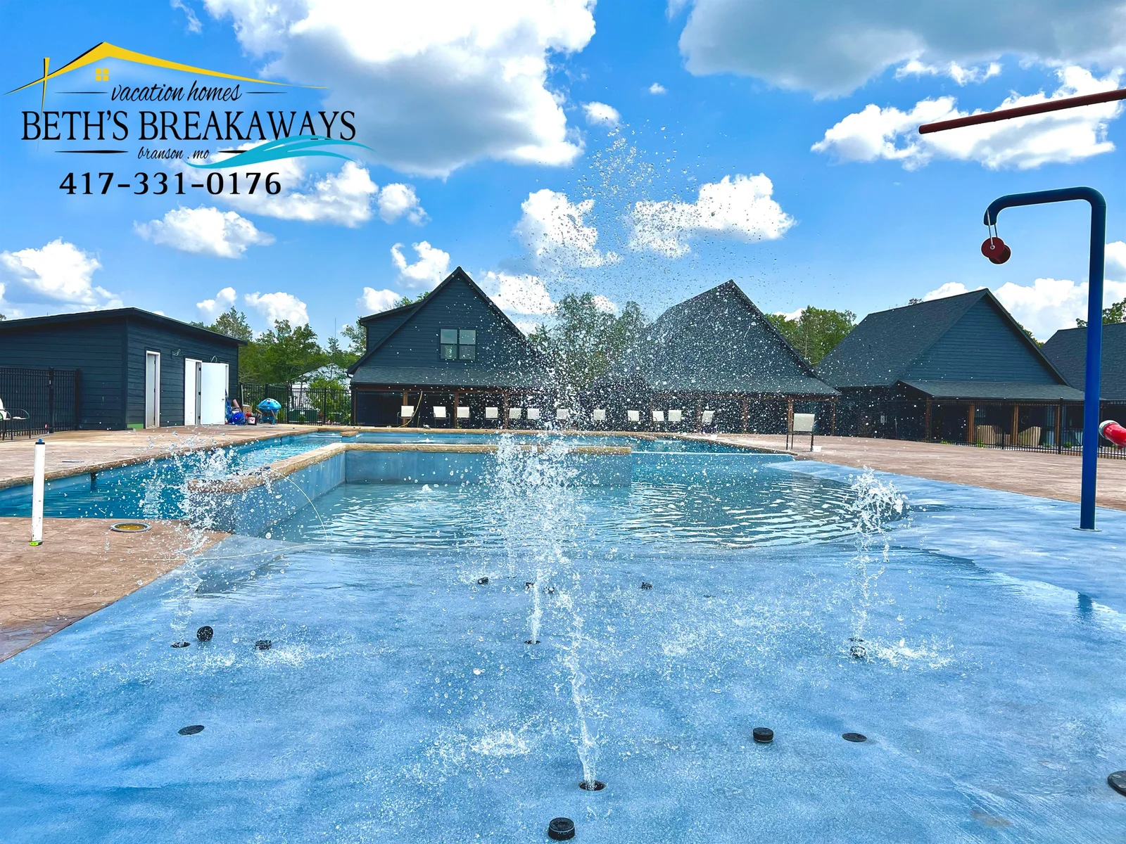 Zero-entry community pool with slide and splash pad