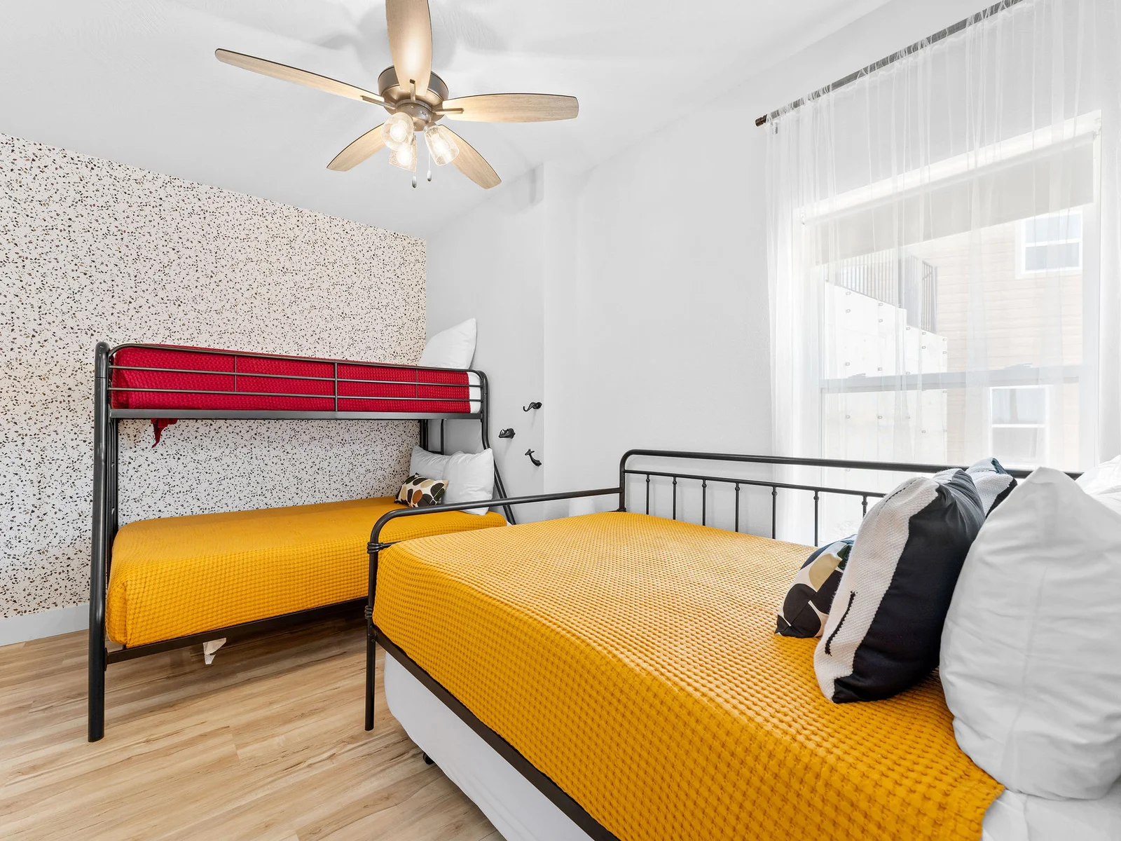 Lower level bedroom w/ trundle, full, and twin beds