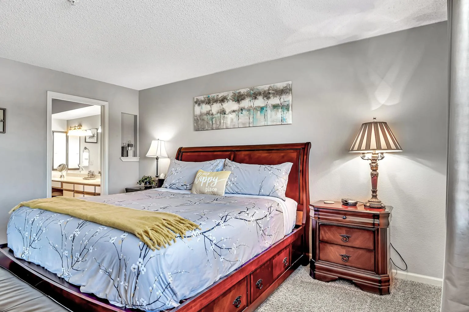 Comfortable king bedroom with plush bedding and soft lighting for a restful stay.