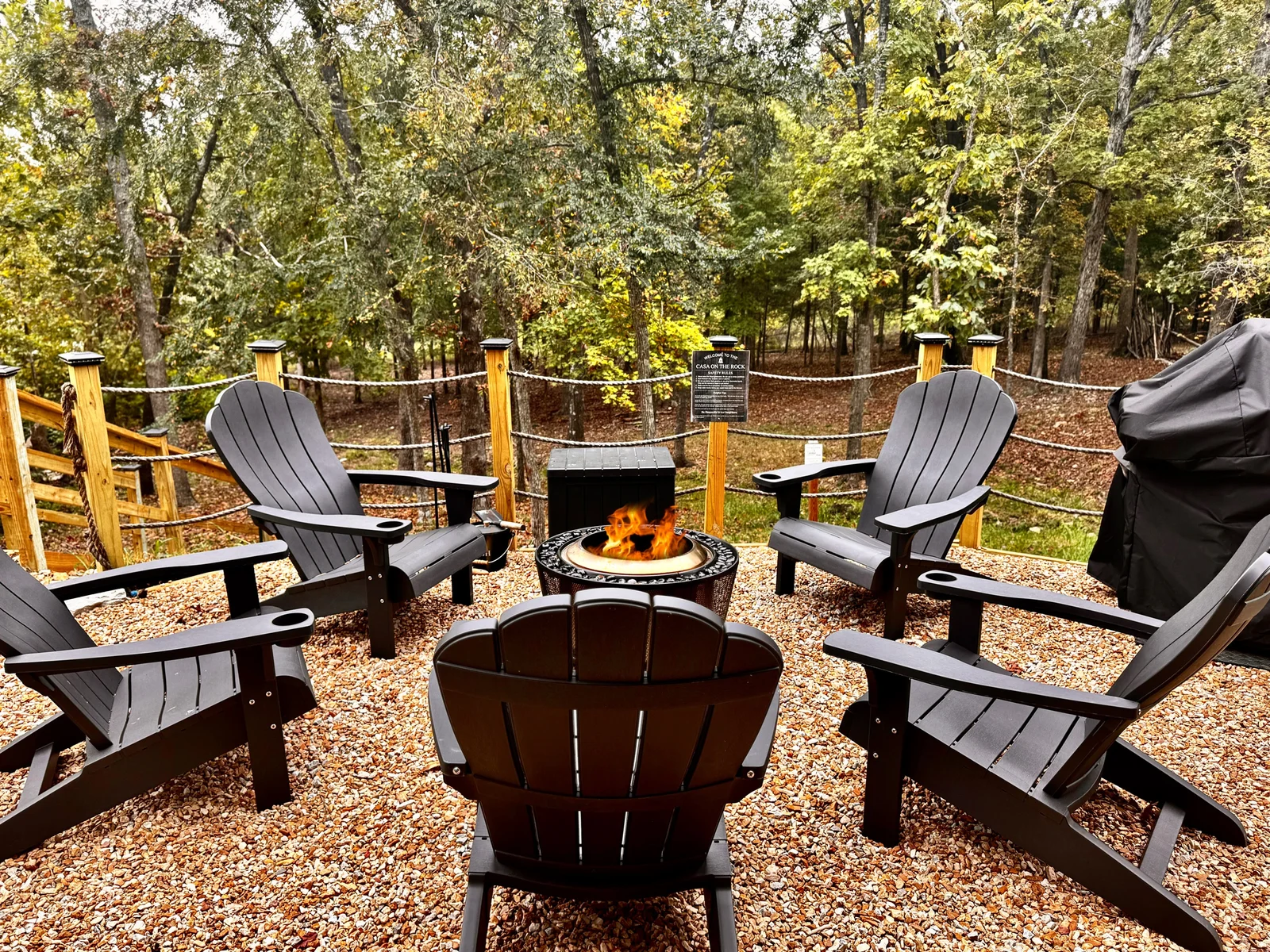Outdoor fire pit with seating and grill
