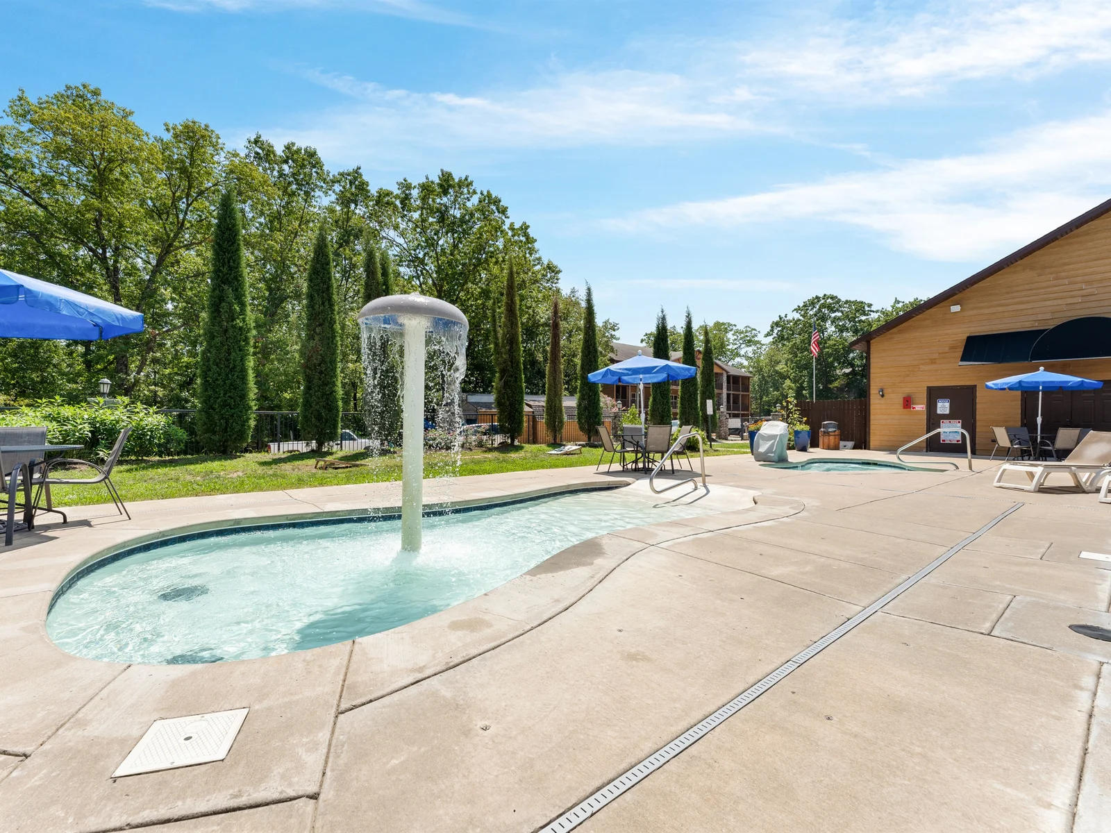 Kids’ Pool Oasis: Splash into fun with our vibrant pool, waterfall feature, and sunny lounge area!