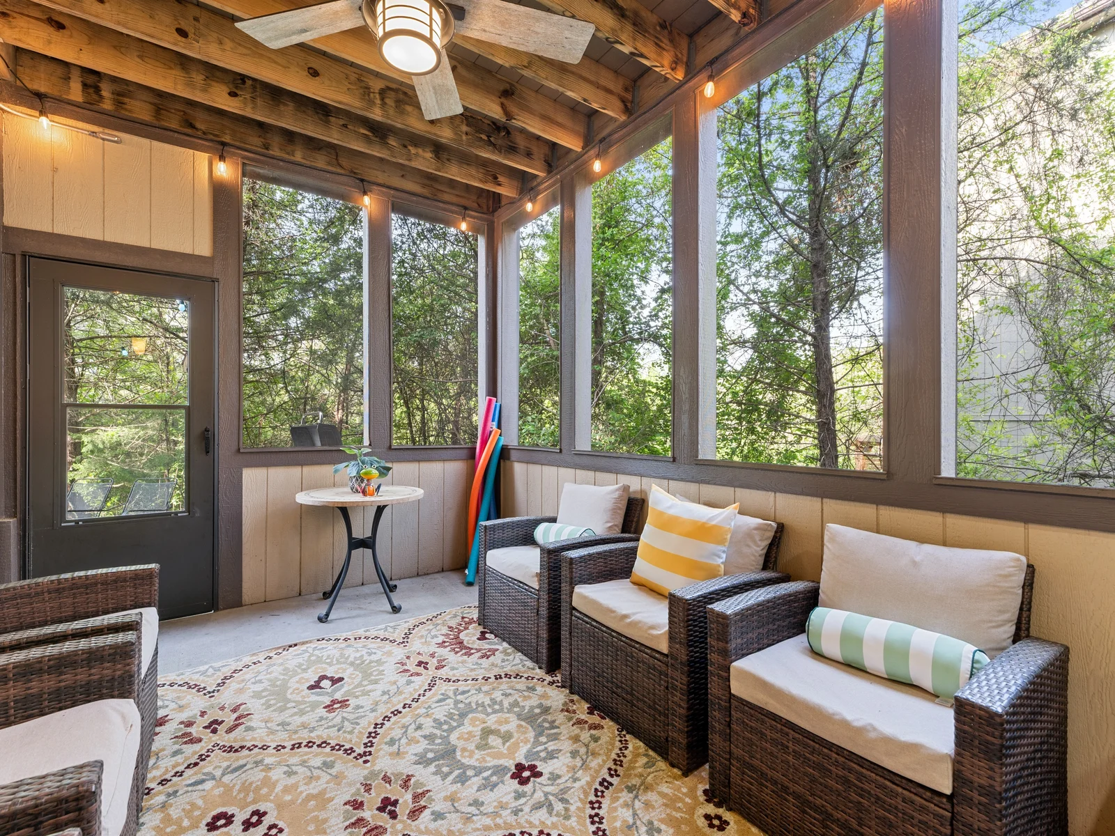 Where the indoors meets the outdoors in this screened in patio