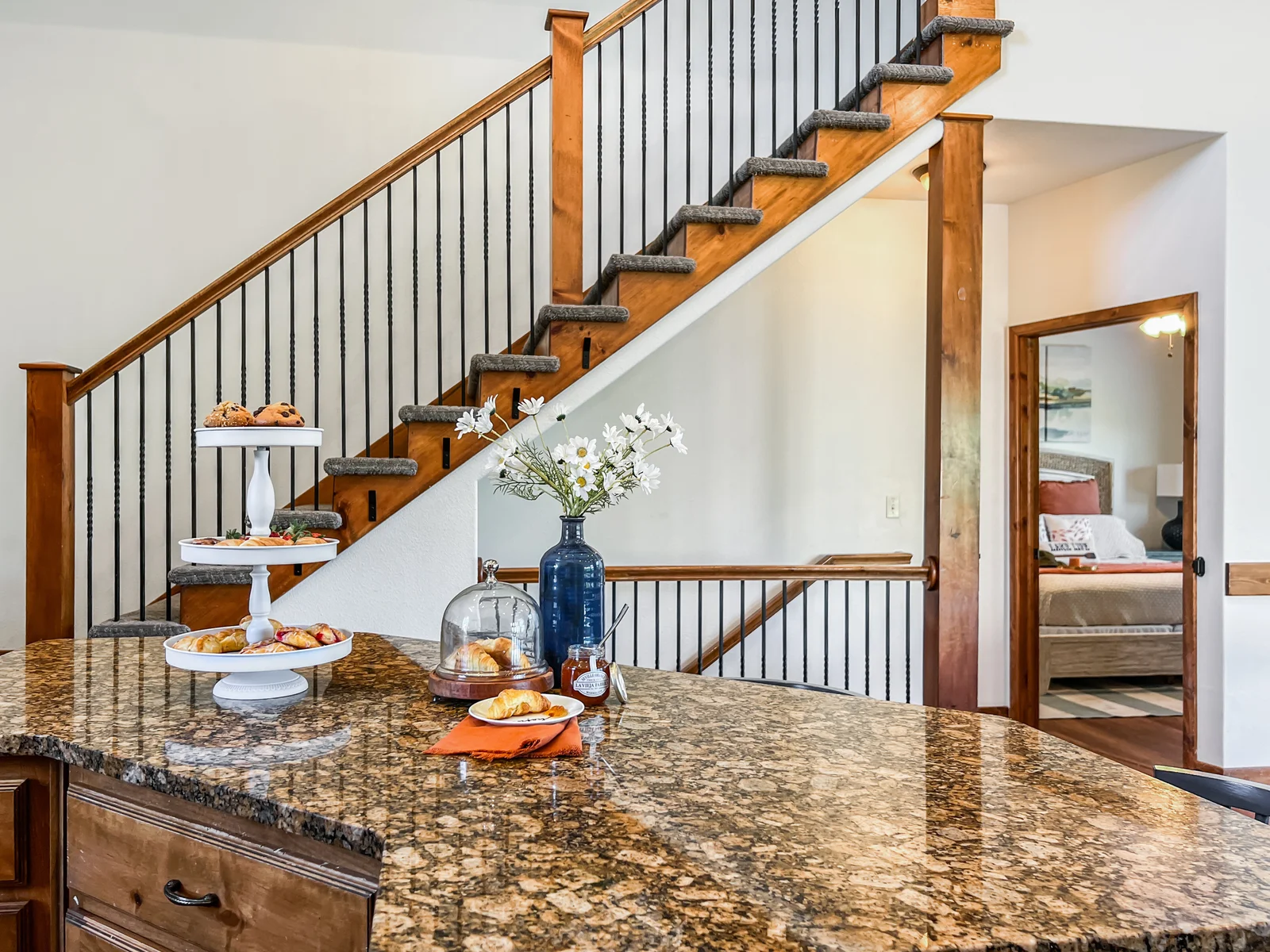 The stairs lead up to a master bedroom and down to the gameroom.