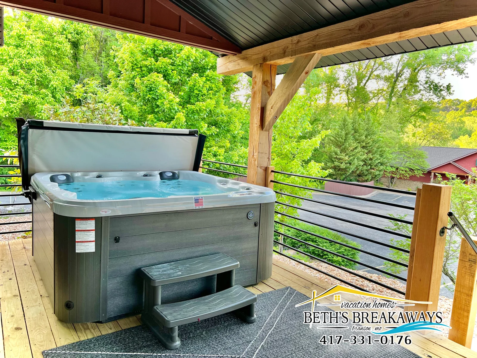 The back porch provides relaxing evenings surrounded by greenery and close to walking trails
