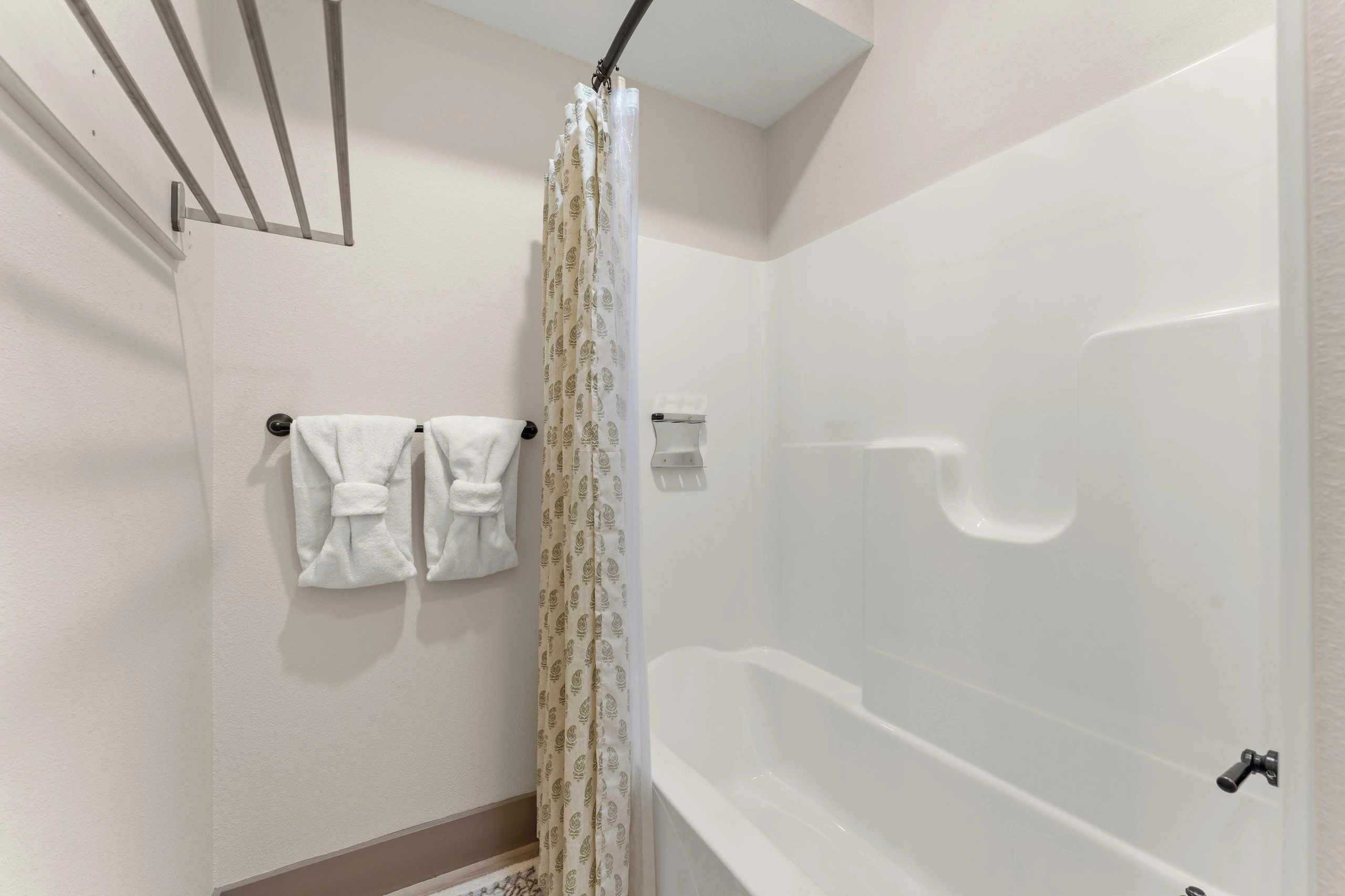 Bedroom downstairs on the right, bathtub/shower combination.