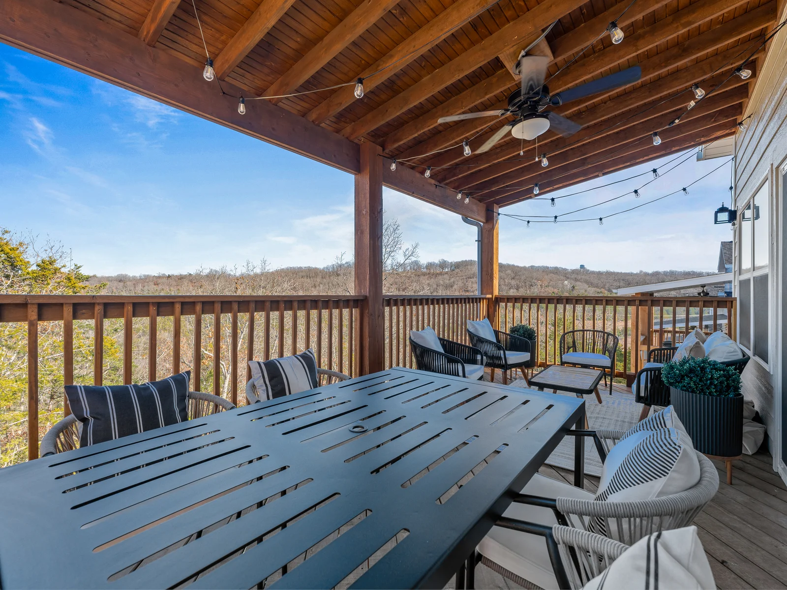 Deck Oasis: Savor breathtaking views while dining or lounging under twinkling lights!