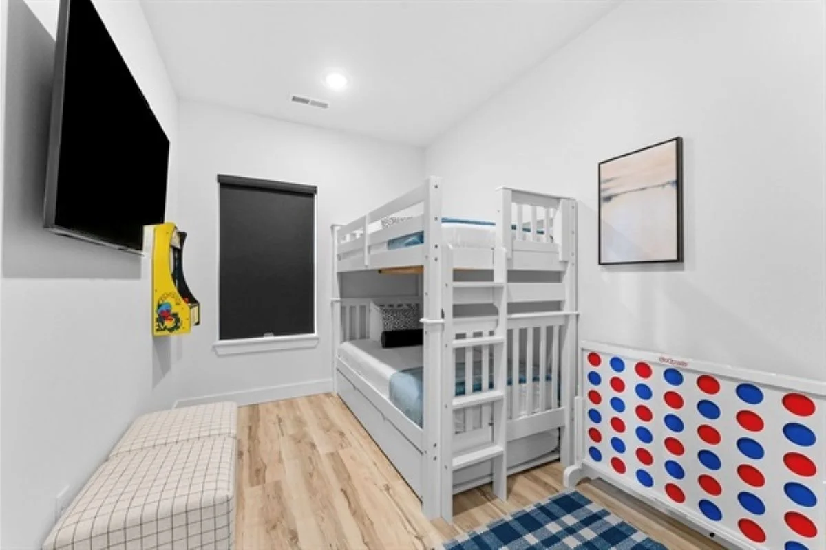 Bunk room with mini PacMan arcade machine