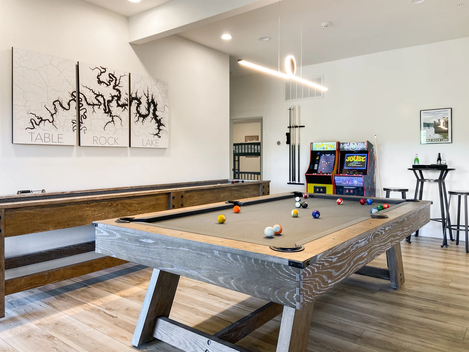 Pool table, shuffleboard, and arcade games
