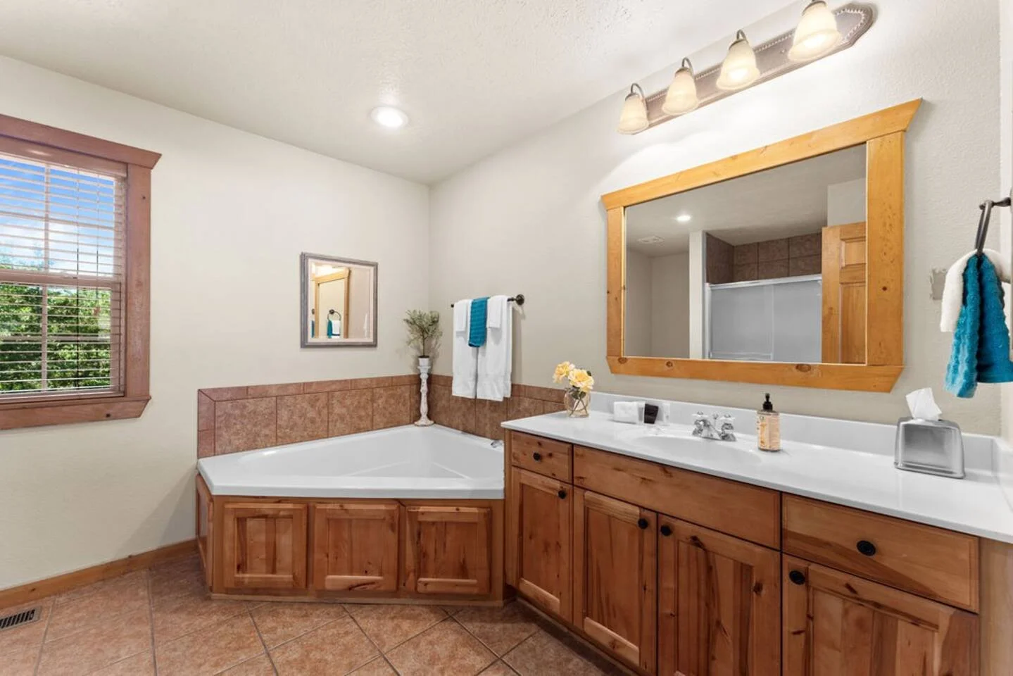 Spacious master bath with jacuzzi tub and a standalone shower unit