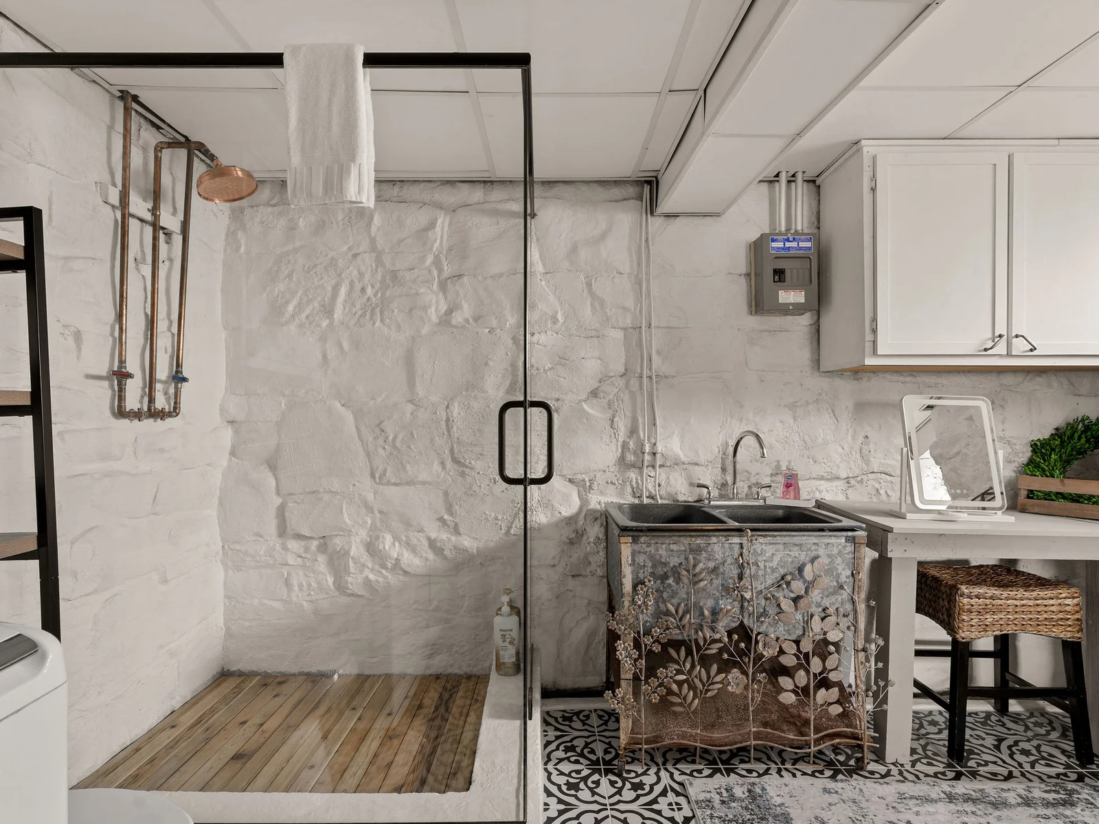 This gorgeous new glass-enclosed shower gave our lower-level bathroom a serious upgrade.