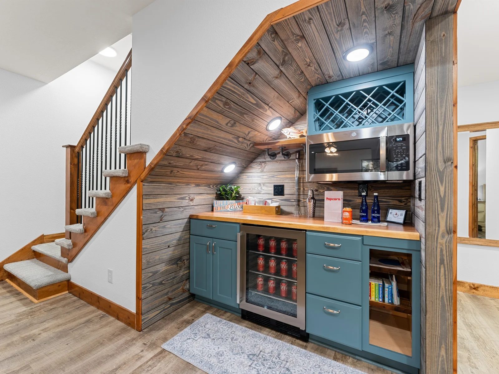 Downstairs offers entertainment and kitchenette (no sink) to store cold drinks, snacks, convenient microwave