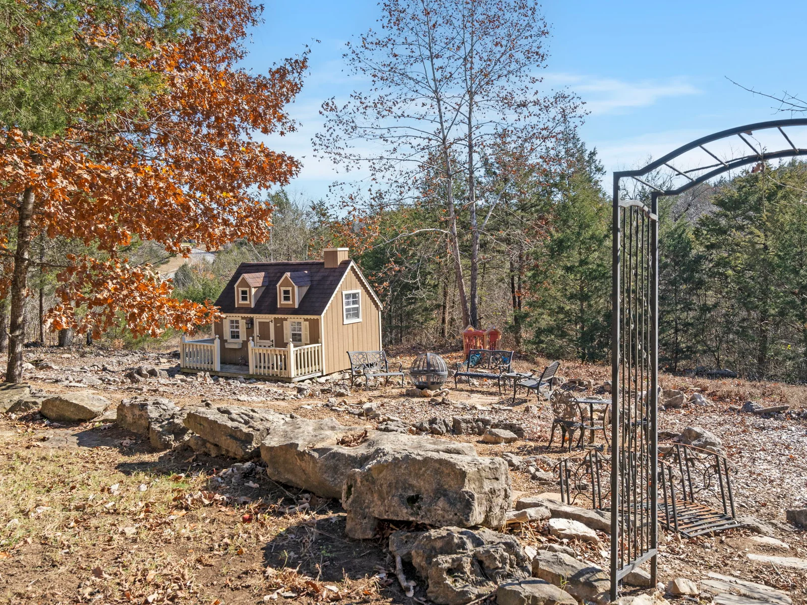 Outdoor mini trail with playhouse kids can use