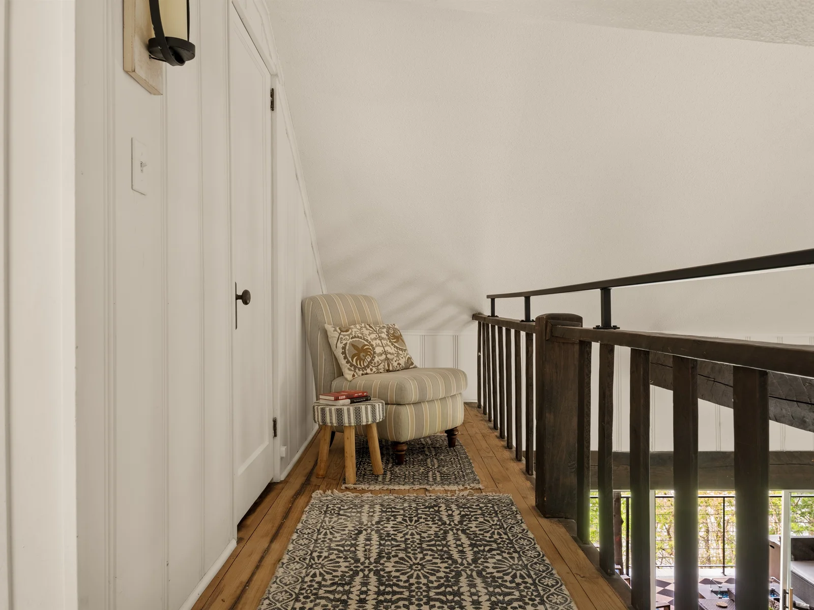 Upper-level nook for reading or relaxing.
