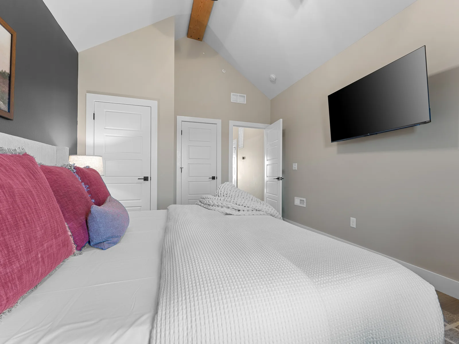 Elegant Retreat: Enjoy a restful night with plush bedding and a sleek TV for ultimate relaxation!
