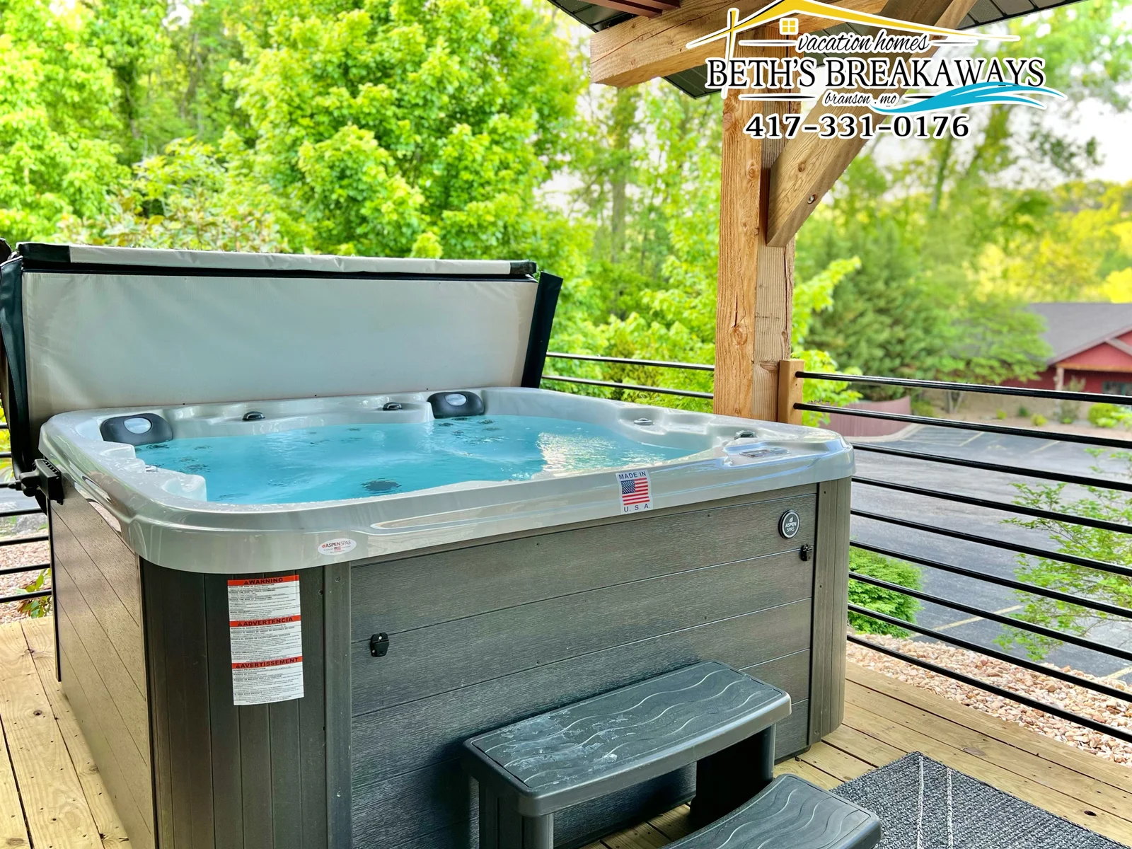 Relax in the warm hot tub and surrounded by lush greenery