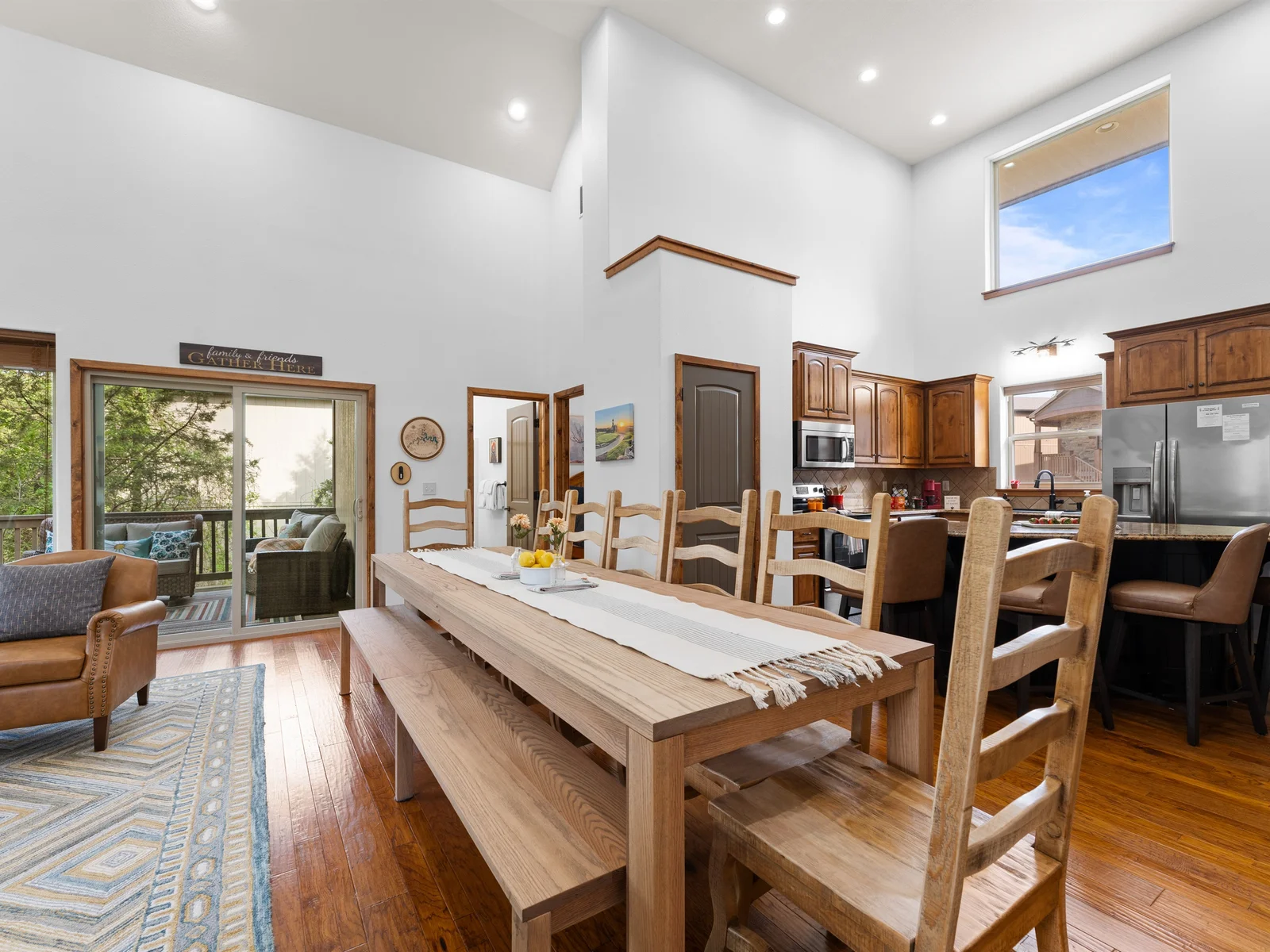There is space for 12 people at the custom 10 ft table, plus 4 counter seats at the kitchen island. You can sit 16 people for a meal in one space.