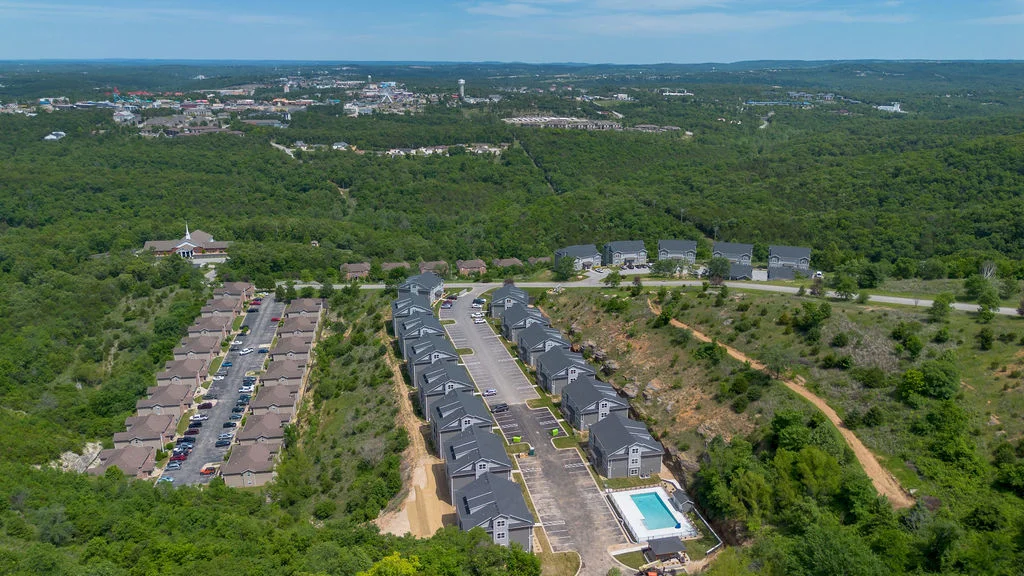 Your setting is nestled at the top of an overlook of the Ozark Mountains from the patio and the Branson 76 Strip from the front