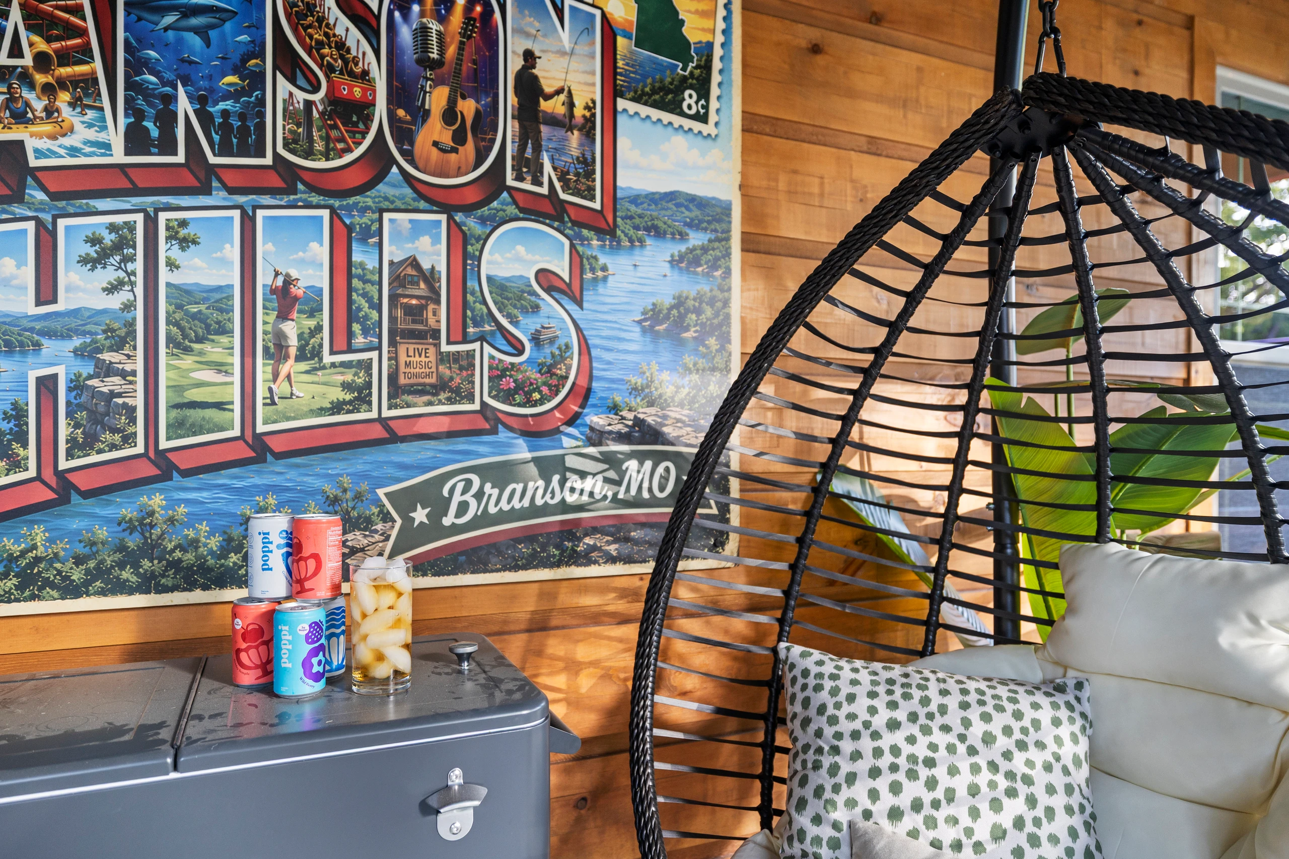 Vintage 'Branson Hills' postcard art brightens the seating nook.