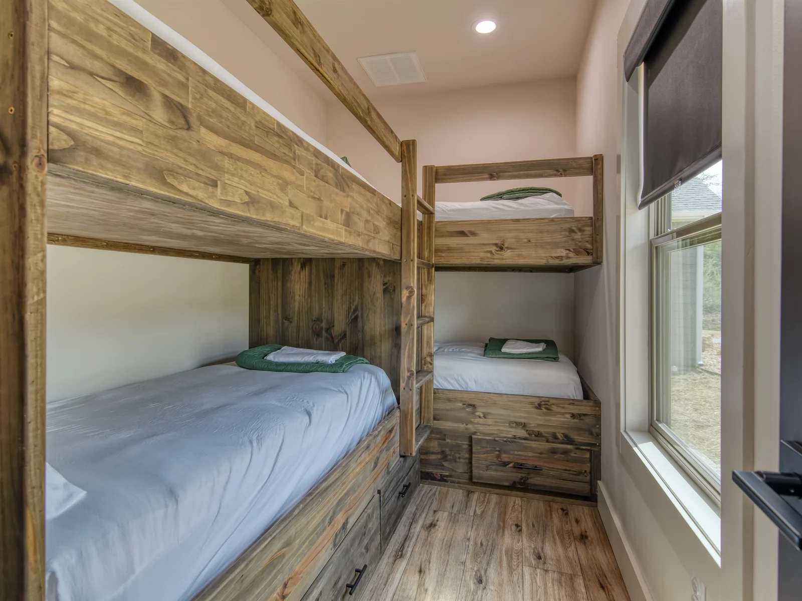 Bunk room sleeps 4. Minimal storage in drawers below.