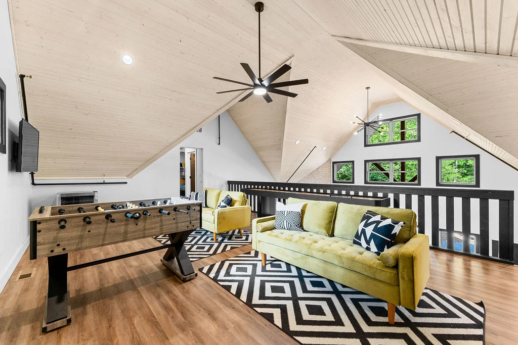 Upper level game area with shuffleboard and foosball