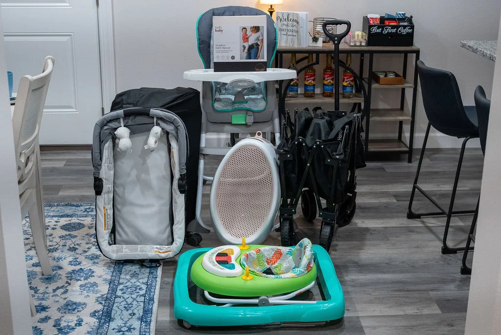You don't have to travel with the large toddler items! We have a pack n play, high chair, walker/activity station, baby carrier, baby bathtub and a wagon to use going to the pool