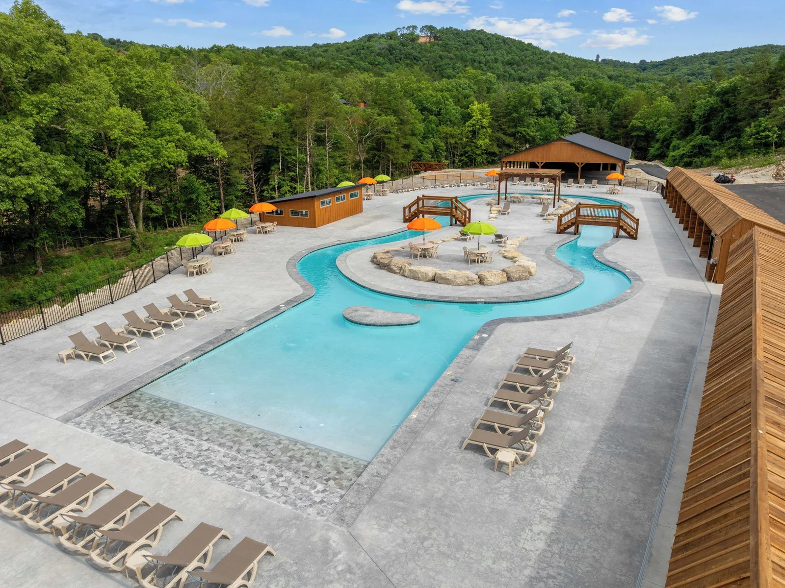 Third pool towards the back of the camp. It is a lazy river! A long walk or you can get there by car with ample parking or golf cart.