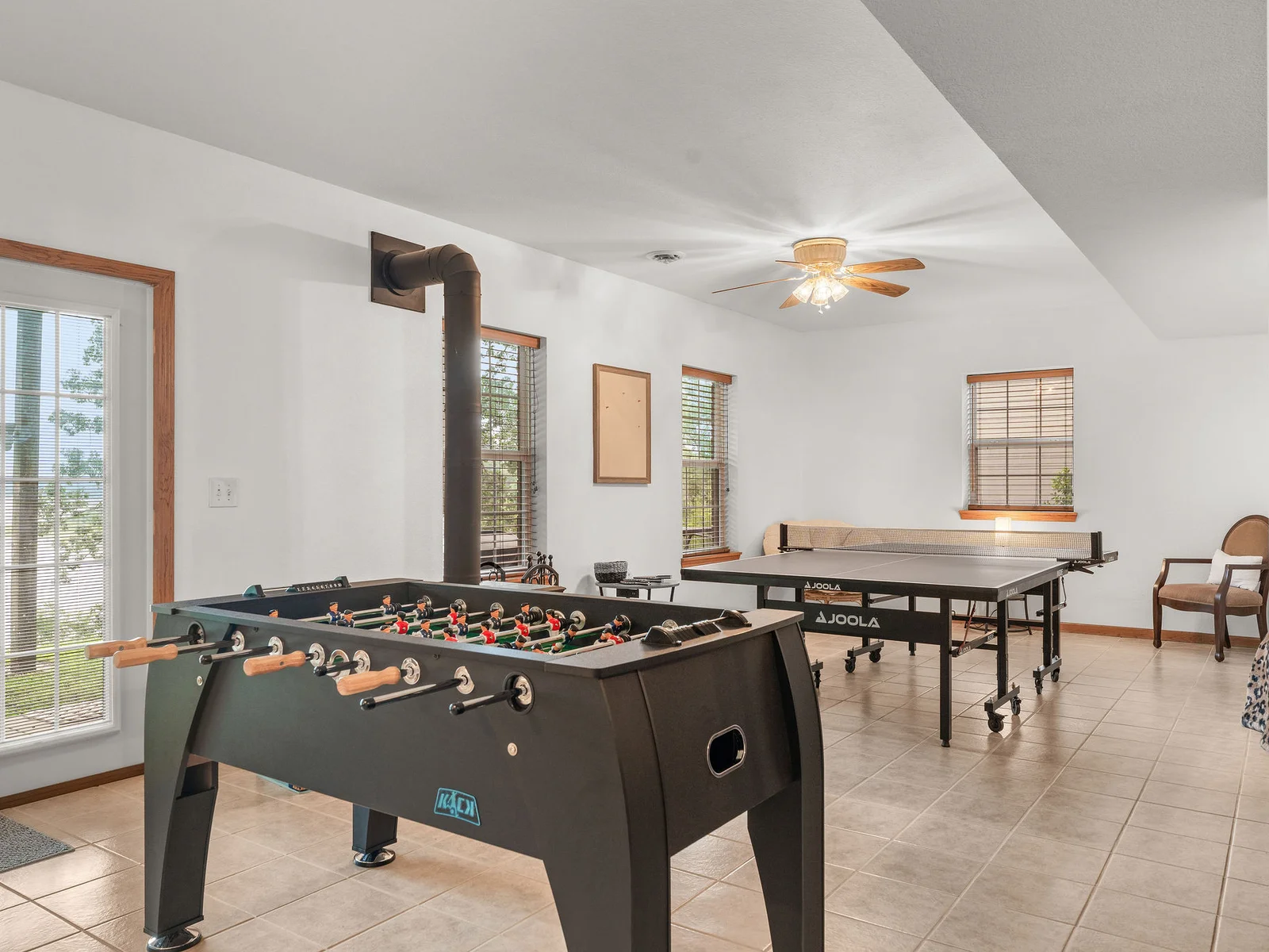 Challenge someone to foosball, then challenge someone else to ping pong — both tables are full-size and regulation-ready, right here in the basement.