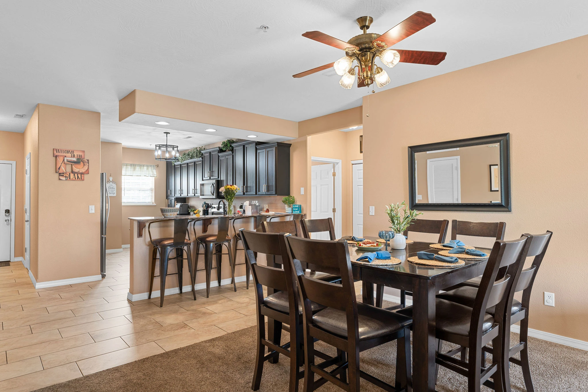 The kitchen has an eat-in bar area next to the dining area so everyone can eat a meal together
