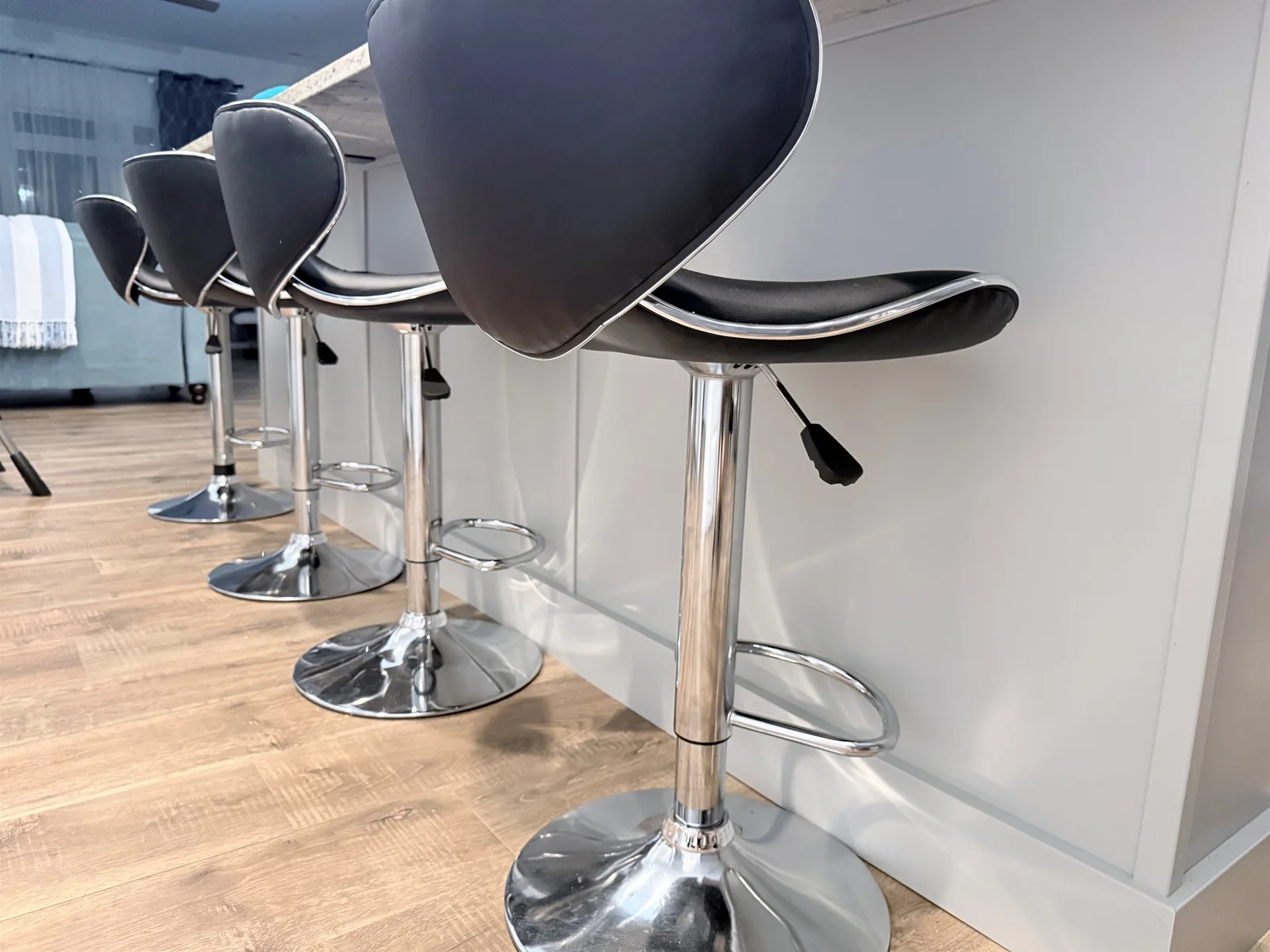 adjustable stools at large kitchen island