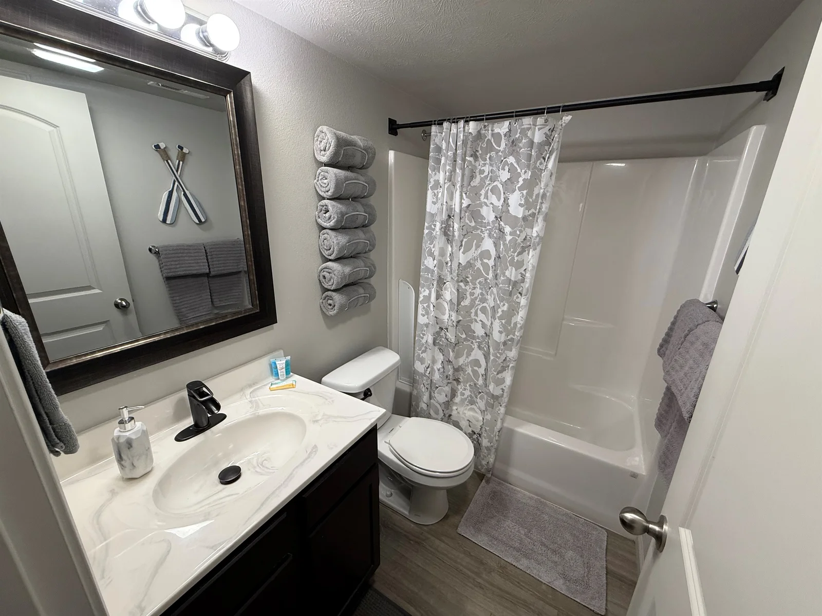 guest bathroom with closet behind door